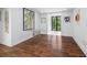 Bright sitting area with hardwood floors, neutral walls, and view to the backyard at 11260 Houze Rd, Roswell, GA 30076