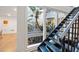 Modern staircase overlooking an interior courtyard with lush greenery, bringing the outdoors in at 11260 Houze Rd, Roswell, GA 30076