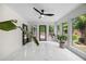 Beautiful sun room with marble floors, large windows, and lots of sunlight at 11260 Houze Rd, Roswell, GA 30076