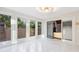 Bright sunroom with large windows, offering serene views and a seamless transition to outdoor living at 11260 Houze Rd, Roswell, GA 30076