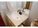 Close-up of bathroom vanity with hard surface counter and bronze faucet at 139 6Th St, Auburn, GA 30011
