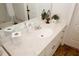 Bathroom vanity with white countertop, drawers, a mirror, decor, and tiled flooring at 139 6Th St, Auburn, GA 30011