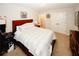 Comfortable bedroom with a plush bed, neutral walls, carpeted floor, and a spacious closet at 139 6Th St, Auburn, GA 30011