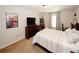 Inviting bedroom featuring neutral walls, carpeted floor, a large window, and a closet at 139 6Th St, Auburn, GA 30011