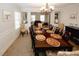 Formal dining room has seating for 10 with large wood table and side chairs at 139 6Th St, Auburn, GA 30011