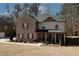 Attractive two-story home with brick and siding, offering a cozy covered front porch and manicured landscaping at 139 6Th St, Auburn, GA 30011