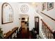 Inviting foyer with hardwood floors, a staircase with iron spindles, and an open view to the living room at 139 6Th St, Auburn, GA 30011