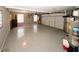 Spacious garage with speckled epoxy floor, storage, bicycle and two windows allowing natural light at 139 6Th St, Auburn, GA 30011