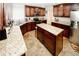 Gourmet kitchen featuring dark wood cabinets and granite countertops, with tile floors at 139 6Th St, Auburn, GA 30011