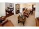 Inviting living room boasts brown leather seating and opens to dining area at 139 6Th St, Auburn, GA 30011