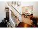 Warm living room with hardwood floors, plush furnishings, open view to an adjacent living space, and a staircase at 139 6Th St, Auburn, GA 30011