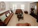 Carpeted living room with brown leather sofas and a decorative coffee table at 139 6Th St, Auburn, GA 30011