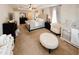 Spacious main bedroom with tray ceiling, ceiling fan, neutral walls, and a carpeted floor at 139 6Th St, Auburn, GA 30011