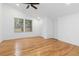 Bright bedroom features hardwood floors, neutral walls, and two windows at 2155 Venetian Sw Dr, Atlanta, GA 30311