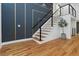 Stairway with contemporary cable railing and hardwood floors at 2155 Venetian Sw Dr, Atlanta, GA 30311