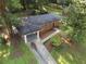 Aerial view of a charming brick home with a covered carport and a well-maintained front yard at 2764 Riggs Dr, Atlanta, GA 30344