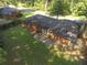 Aerial shot showcases a brick home with a large backyard, patio area, and partial fencing at 2764 Riggs Dr, Atlanta, GA 30344