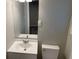 Bathroom with a white toilet and sink/vanity combo at 2764 Riggs Dr, Atlanta, GA 30344