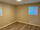 Bedroom featuring a wood-look floor and natural light from two windows at 2764 Riggs Dr, Atlanta, GA 30344