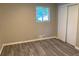 Bedroom featuring a wood-look floor, natural light from a window, and a closet at 2764 Riggs Dr, Atlanta, GA 30344