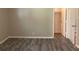 Bedroom featuring plank floors, neutral paint, closet, and an en-suite bathroom at 2764 Riggs Dr, Atlanta, GA 30344