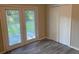 Bedroom featuring a wood-look floor, backyard view, and a closet at 2764 Riggs Dr, Atlanta, GA 30344