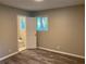 Bedroom with wood-look floors and view to the bathroom at 2764 Riggs Dr, Atlanta, GA 30344