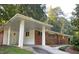 Brick home with a convenient covered carport and manicured lawn at 2764 Riggs Dr, Atlanta, GA 30344