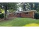 Traditional brick home featuring mature trees in a tranquil setting at 2764 Riggs Dr, Atlanta, GA 30344