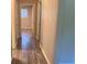 Hallway featuring wood-look floors and doors leading to other rooms in the house at 2764 Riggs Dr, Atlanta, GA 30344