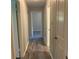 Hallway with wood-look floors and doors leading to other rooms in the house at 2764 Riggs Dr, Atlanta, GA 30344