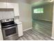 Updated kitchen featuring stainless appliances and an open view into the living space at 2764 Riggs Dr, Atlanta, GA 30344