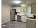 Contemporary kitchen with stainless steel appliances and modern lighting fixtures at 2764 Riggs Dr, Atlanta, GA 30344