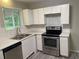 Well-equipped kitchen with modern appliances, ample counter space, and stainless steel appliances at 2764 Riggs Dr, Atlanta, GA 30344