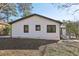 Home with white siding, black trim windows, and a well-maintained lawn offering simple, sophisticated curb appeal at 384 Carey Dr, Atlanta, GA 30315