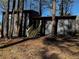 Backyard view of the home's freshly painted exterior with a new wooden staircase at 1154 Stone Mill Run, Lawrenceville, GA 30046