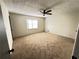 Spacious bedroom with plush carpet, neutral walls, and a large window for ample natural light at 1154 Stone Mill Run, Lawrenceville, GA 30046