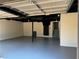 Spacious two-car garage featuring newly painted walls and floors at 1154 Stone Mill Run, Lawrenceville, GA 30046