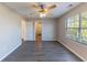 Bright bedroom with ceiling fan, closet, and a large window for natural light at 527 Carlton E Dr, Palmetto, GA 30268