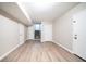 Unfurnished basement with neutral walls and wood-look flooring at 8904 Creekwood Ct, Riverdale, GA 30274