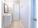 Cozy bathroom featuring a tile floor, single sink and towel rack at 8904 Creekwood Ct, Riverdale, GA 30274
