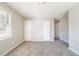 Neutral bedroom with carpet, freshly painted walls, and a closet at 8904 Creekwood Ct, Riverdale, GA 30274