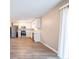 Kitchen with stainless steel appliances, light wood floors, and white cabinets and countertops at 8904 Creekwood Ct, Riverdale, GA 30274
