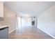 Open concept space featuring updated flooring, a stainless steel dishwasher, and access to the second floor at 8904 Creekwood Ct, Riverdale, GA 30274