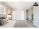 Staged main bedroom with carpet, freshly painted walls, and a closet at 8904 Creekwood Ct, Riverdale, GA 30274