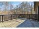 This home's deck is spacious and provides a quiet place to enjoy the view of the surrounding trees at 93 Mill Creek Rd, Hiram, GA 30141