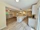 Spacious, light-filled kitchen with island, granite counters, white cabinetry, and stainless steel appliances at 93 Mill Creek Rd, Hiram, GA 30141