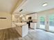 Bright kitchen with white cabinets, granite countertops, an island, and stainless steel appliances for a modern feel at 93 Mill Creek Rd, Hiram, GA 30141