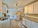Elegant kitchen featuring granite countertops, white cabinets, stainless appliances, and a view of the open living area at 93 Mill Creek Rd, Hiram, GA 30141