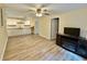 Open-concept room featuring a kitchen, light walls, and hardwood-style floors for modern living at 93 Mill Creek Rd, Hiram, GA 30141